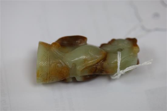 A Chinese pale celadon and russet jade finial, Song dynasty or later, H.5.4cm